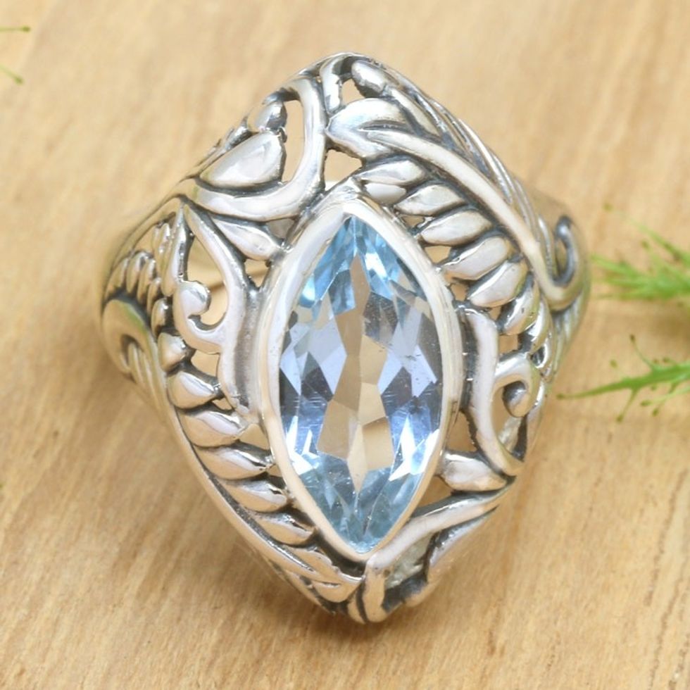 Blue topaz single stone ring 'Joyous Jungle'