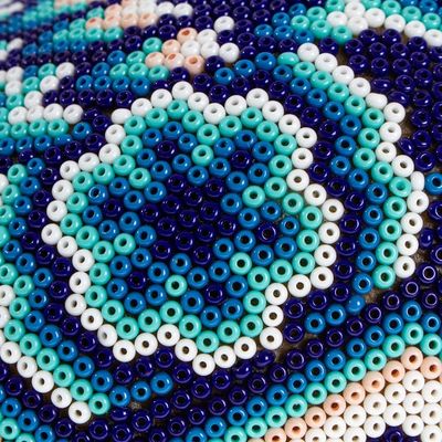 Alternate image for Huichol Beaded Dark Blue Skull with Huichol Icons Eagle Mother