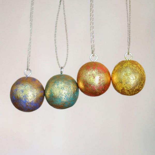 Alternate image for Four Round Gold Tone Albesia Wood Ornaments from Bali Golden Baubles