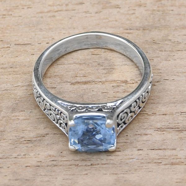 Alternate image for Blue Topaz and Sterling Silver Swirl Motif Solitaire Ring Sparkling Heavens