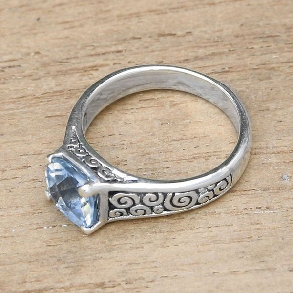 Alternate image for Blue Topaz and Sterling Silver Swirl Motif Solitaire Ring Sparkling Heavens