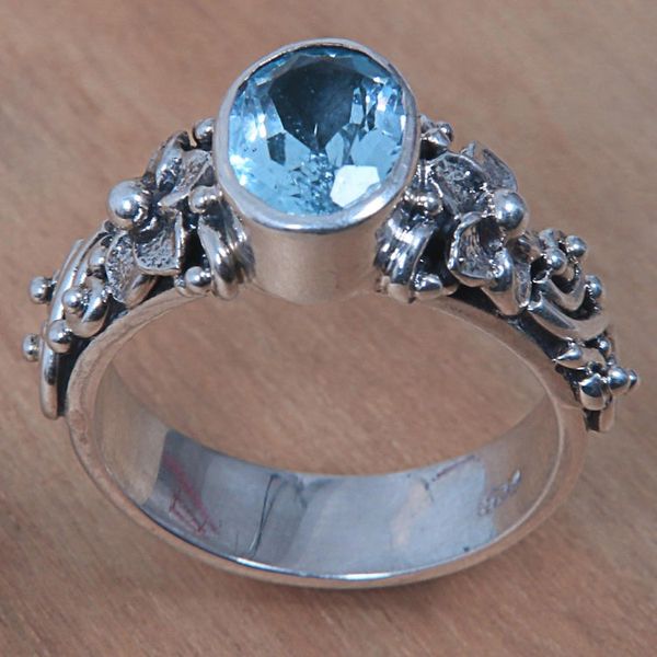 Alternate image for Oval Cut Blue Topaz and Silver Ring with Floral Design Frangipani Path