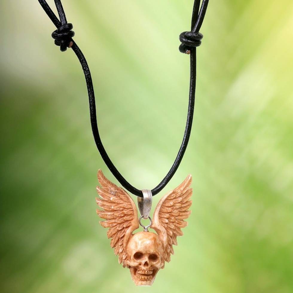 Hand Carved Bone Pendant Necklace of a Skull from Indonesia 'Flying Skull'