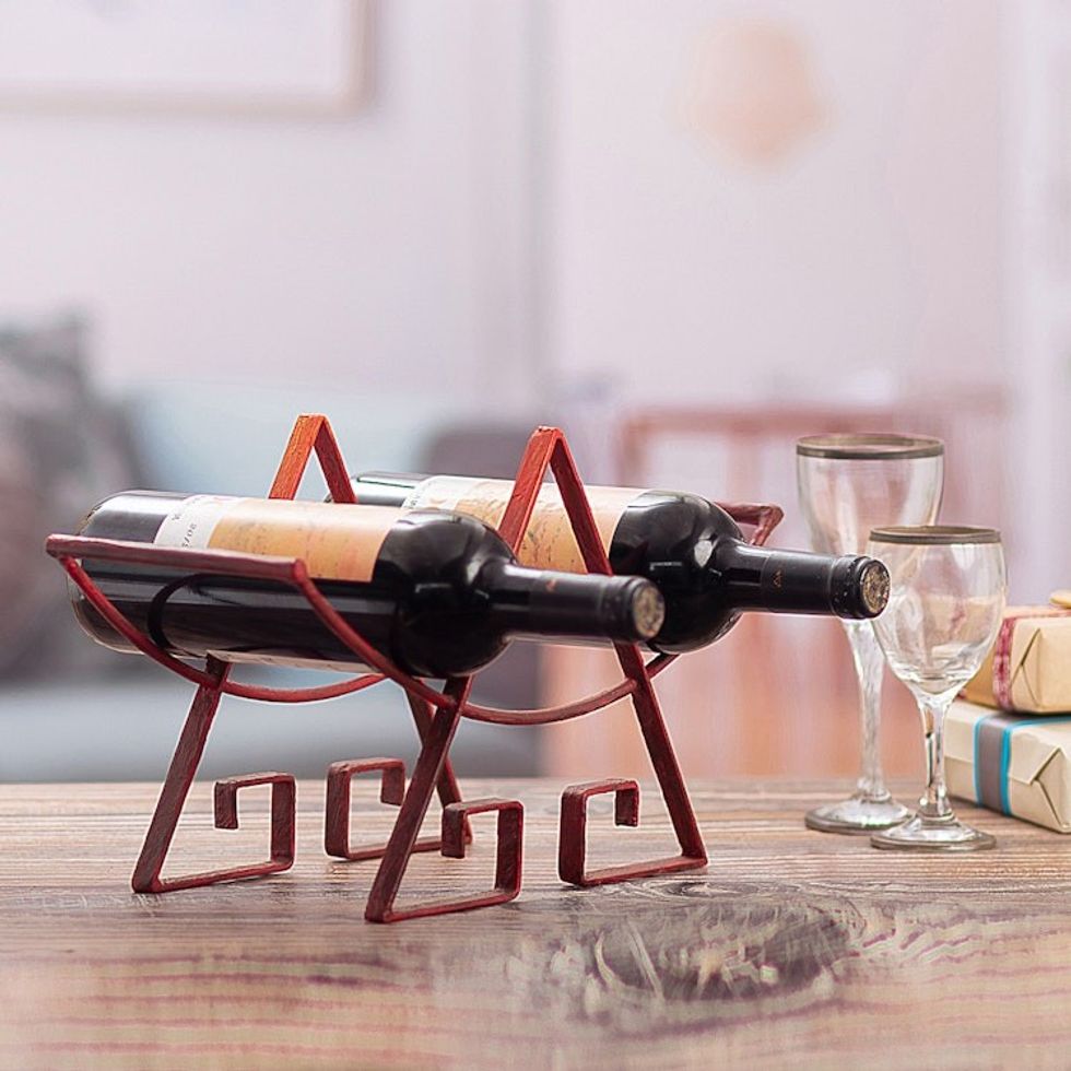 Steel wine bottle holder 'Inca Glyph'