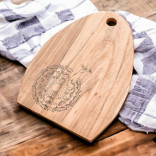 Alternate image for Semi-Oval Laurel Wood Cutting Board with Dandelion Engraving Dandelions Treats