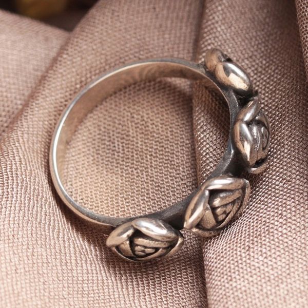 Alternate image for Sterling Silver Band Ring Crowned by Four Rose Accents Rose Sophistication