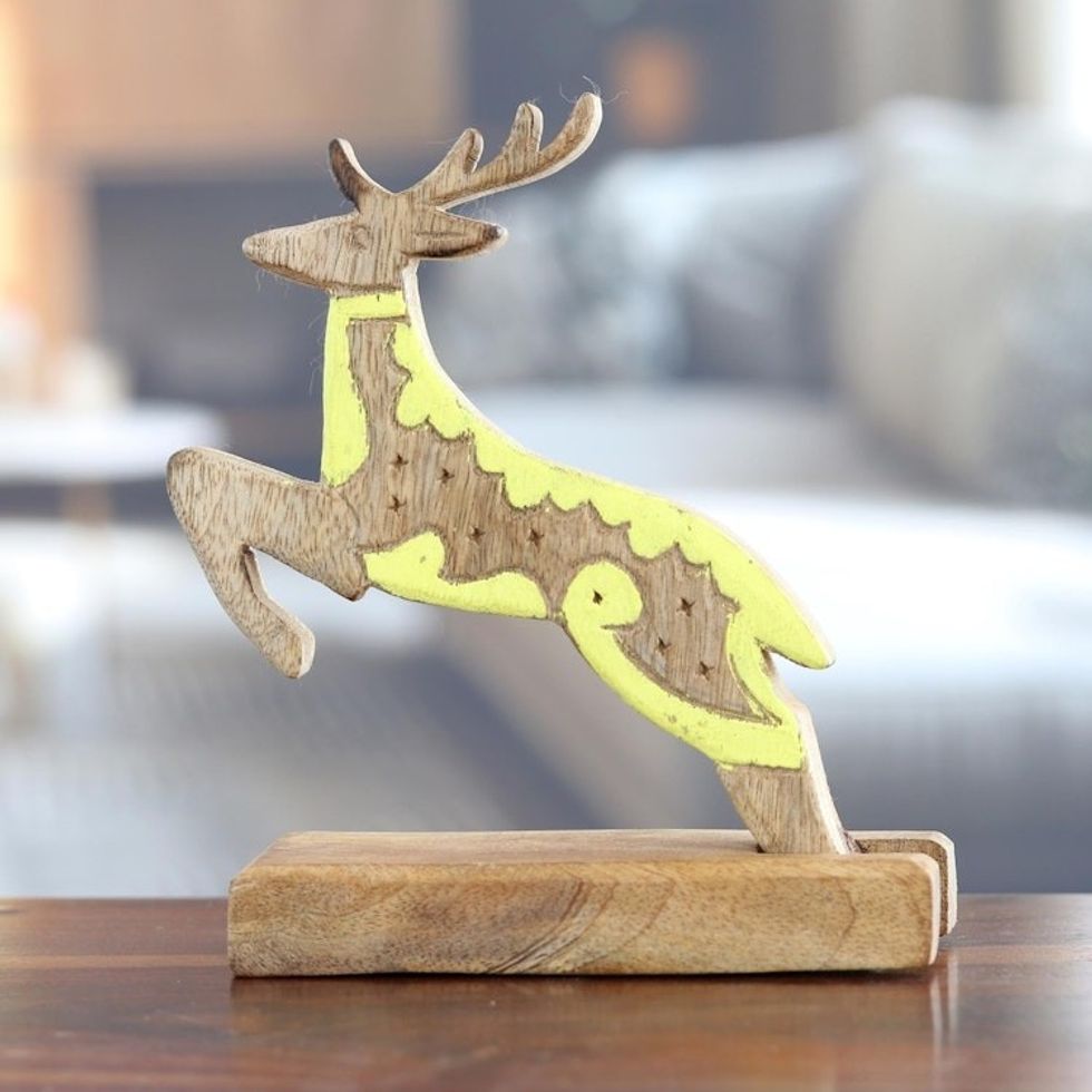 Hand-Carved Mango Wood Reindeer Sculpture with Yellow Tones 'Reindeer Dream'
