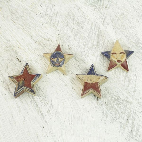 Alternate image for Four Sese Wood Star Ornaments in Red Blue and Beige Nsruma Pride