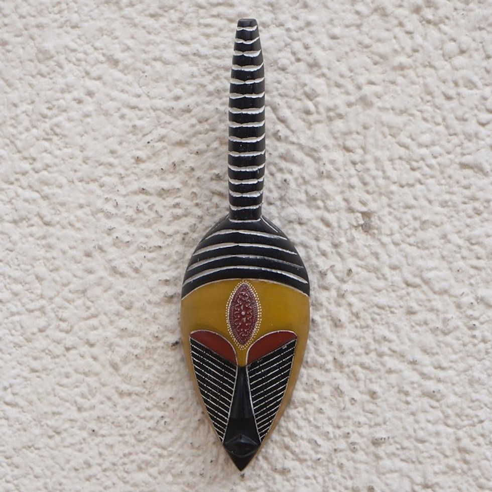 Handcrafted African Sese Wood Mask in Yellow and Black Hues 'Yayravi'
