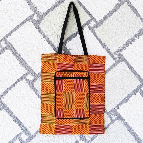 Alternate image for Kente-Themed Yellow and Red Self-Storing Cotton Tote Bag Kente Sunshine