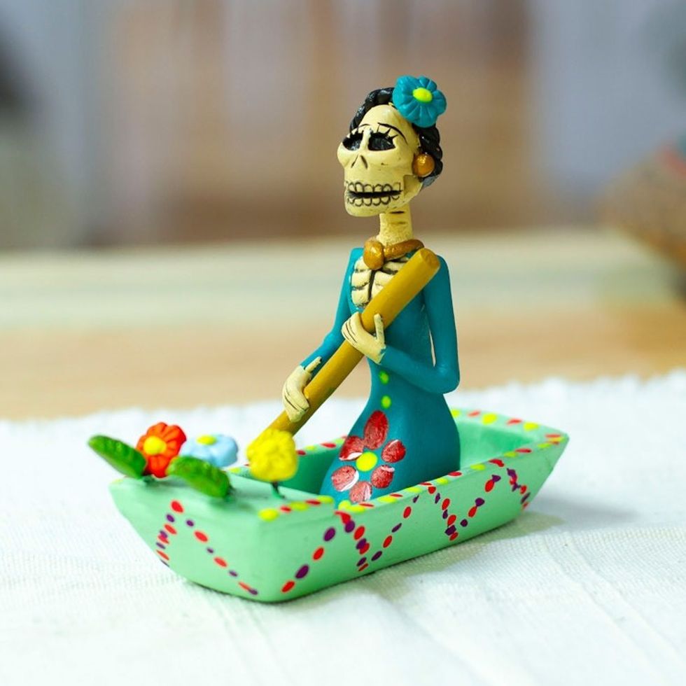 Hand-Painted Catrina on a Boat Ceramic Figurine in Mint Hues 'River Catrina in Mint'