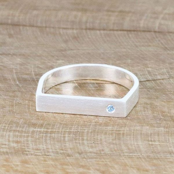 Alternate image for Minimalist Silver Band Ring with Blue Topaz Accent Discreetly Blue