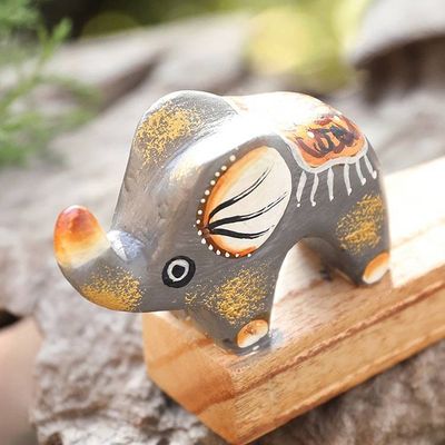 Primary image for Handcrafted Elephant-Themed Grey Jempinis Wood Door Stopper Tiny Giant