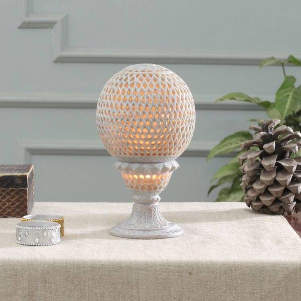 Alternate image for Globe-Shaped Openwork Hand-Carved Soapstone Tealight Holder Reflection from the Past