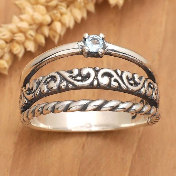 Alternate image for Traditional Single Stone Ring with Faceted Blue Topaz Jewel Jungles Loyal Embrace