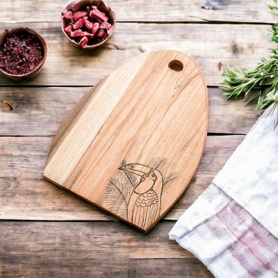 Alternate image for Semi-Oval Laurel Wood Cutting Board with Toucan Engraving Toucans Treats