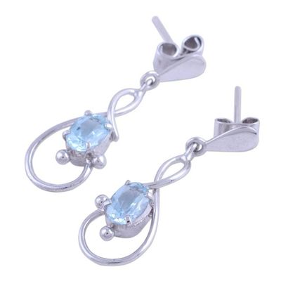 Alternate image for Rhodium Plated Blue Topaz Dangle Earrings from India Beauty Swirls