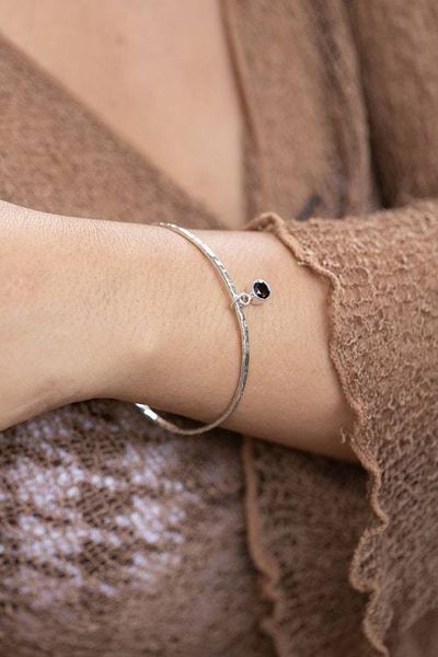 Alternate image for Hammered Silver Bangle Bracelet with Swaying Garnet Pendant Swaying Sparkle