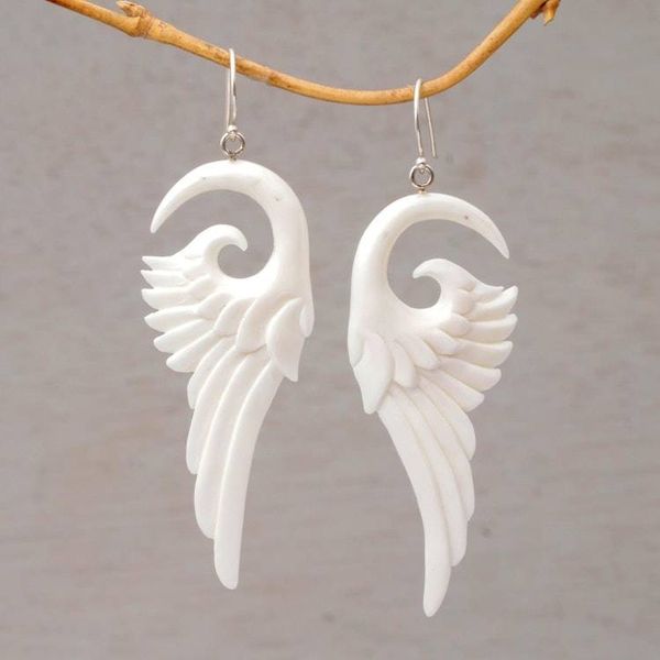 Alternate image for Handcrafted Bone Wing-Shaped Dangle Earrings from Bali Swirling Wings