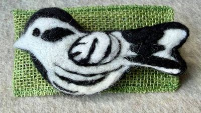 Alternate image for Needle felted bird pin, carefully crafted from wool to create a small, lightweight brooch in black and white