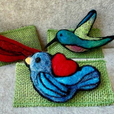 Alternate image for Needle felted blue bird pin, bird with heart, carefully crafted from wool to create a small, lightweight brooch.
