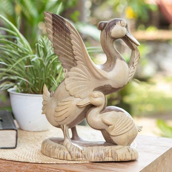 Alternate image for Hibiscus Wood Sculpture of a Mother Duck and Duckling Protective Mother