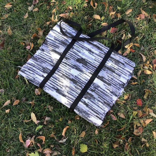 Alternate image for Black and white woven firewood carrier
