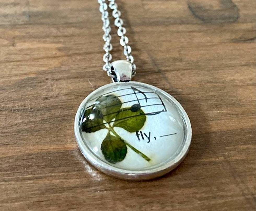 Genuine four-leaf clover necklace with Beatles sheet music ("fly" from Blackbird)