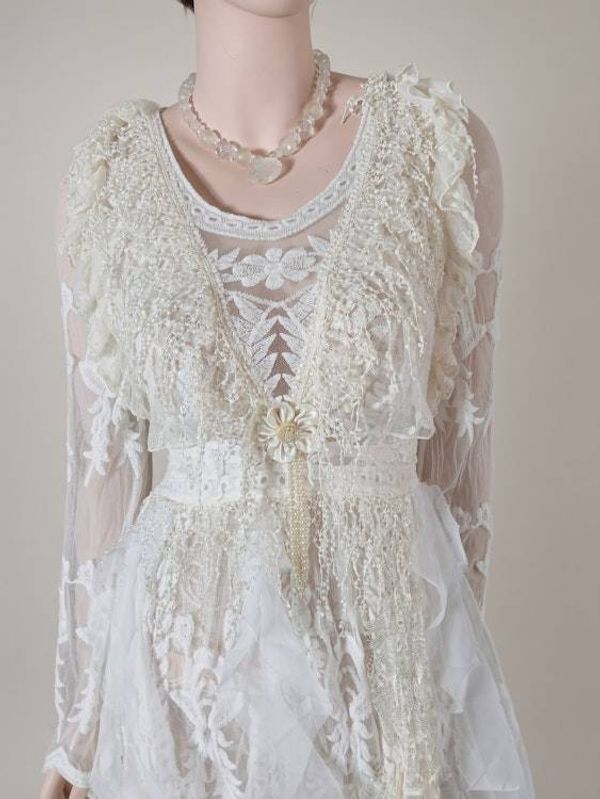 Alternate image for Handcrafted ivory lace long sleeve Tea-Length dress with intricate decor and fringe