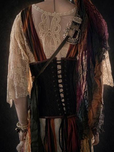Alternate image for Ragged pirate ensemble with layered skirt, embellished corset, headwear and studded belt