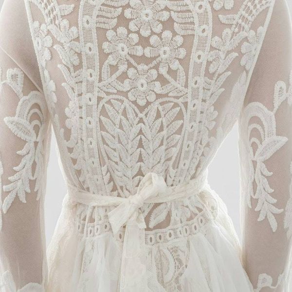 Alternate image for Handcrafted ivory lace long sleeve Tea-Length dress with intricate decor and fringe