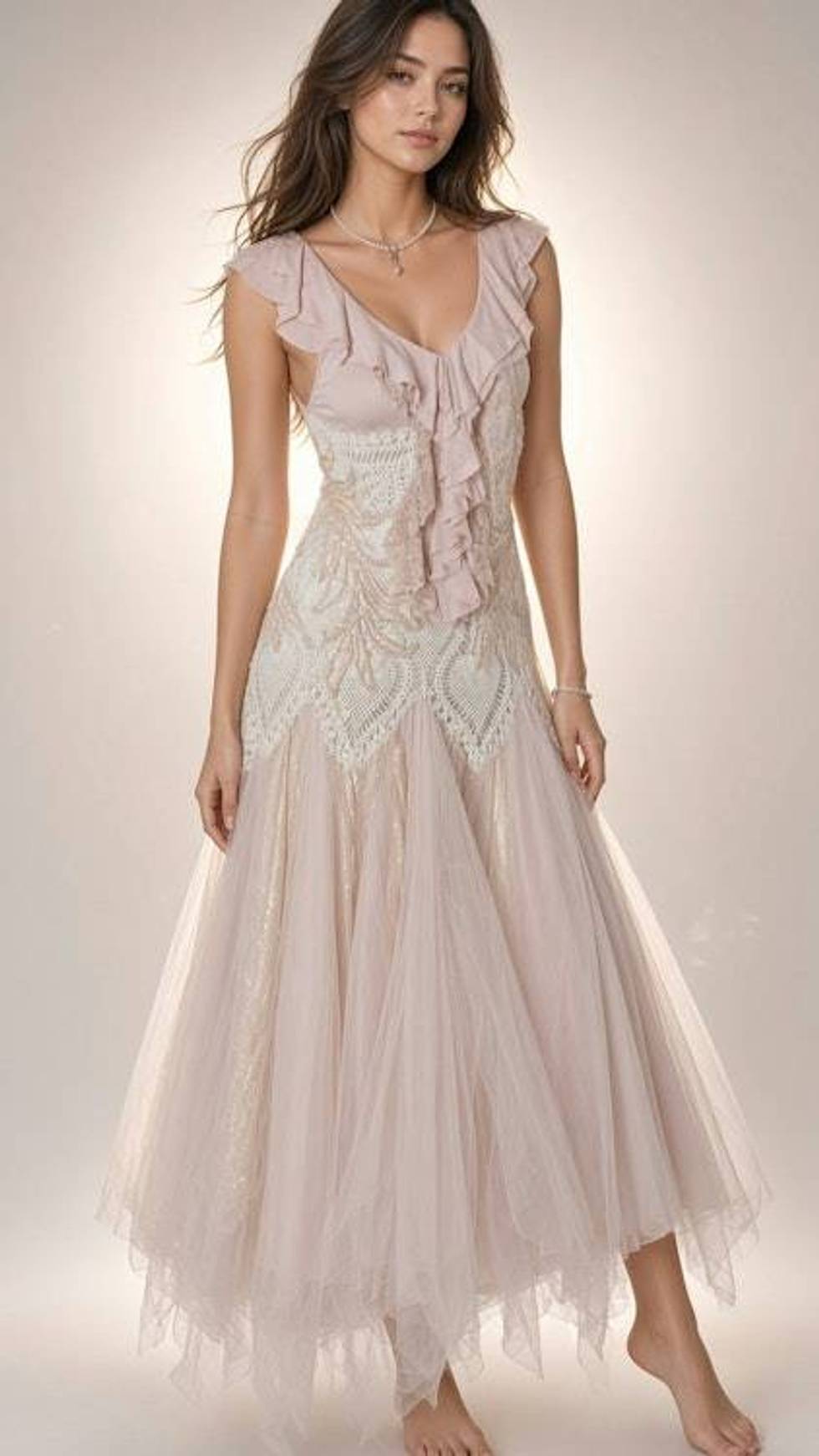 Romantic blush pink tulle dress with ruffled neckline and embellished bodice