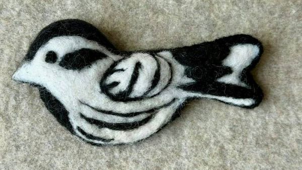 Alternate image for Needle felted bird pin, carefully crafted from wool to create a small, lightweight brooch in black and white