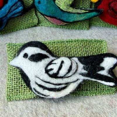 Alternate image for Needle felted bird pin, carefully crafted from wool to create a small, lightweight brooch in black and white