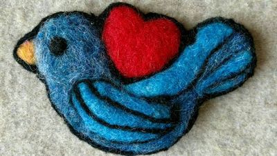 Alternate image for Needle felted blue bird pin, bird with heart, carefully crafted from wool to create a small, lightweight brooch.