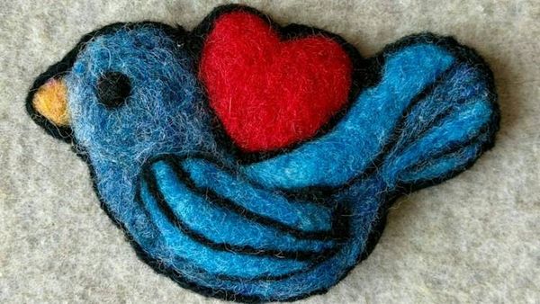 Alternate image for Needle felted blue bird pin, bird with heart, carefully crafted from wool to create a small, lightweight brooch.