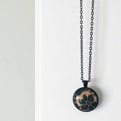Main image for Black Floral Silhouette Necklace – Cork Fabric Under Glass